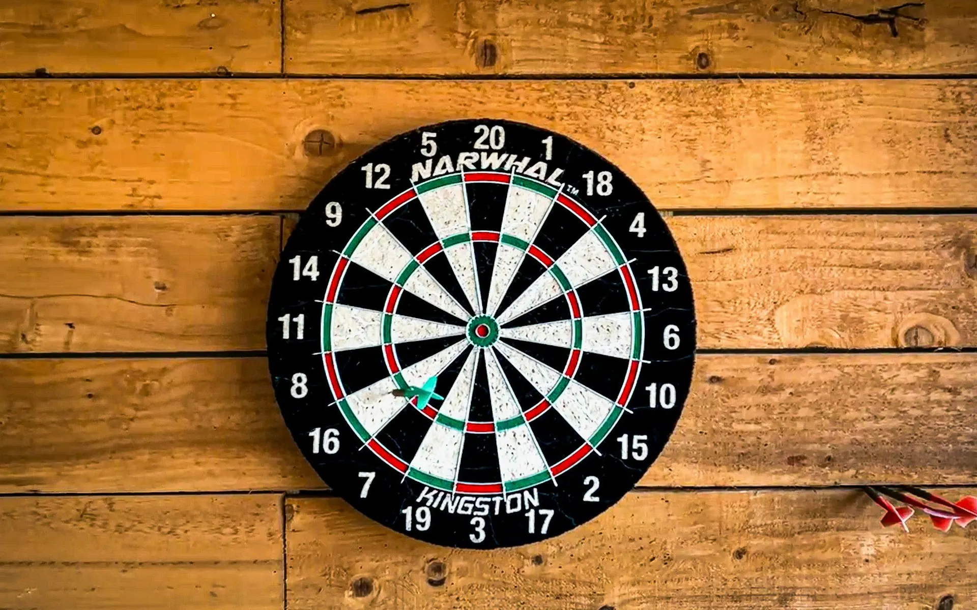 Dartboard mounted on a wooden wall