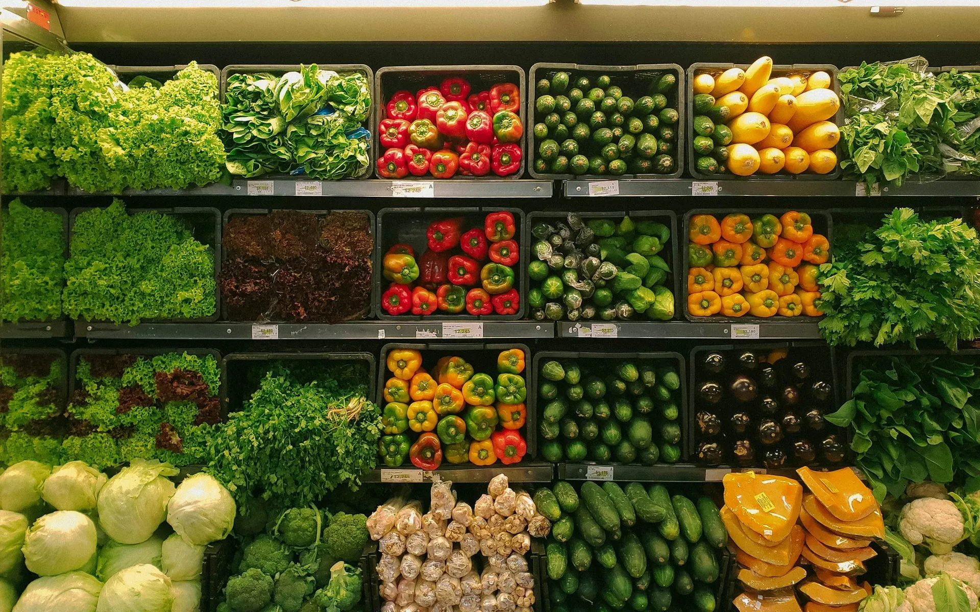 Fresh produce arranged on grocery store shelves