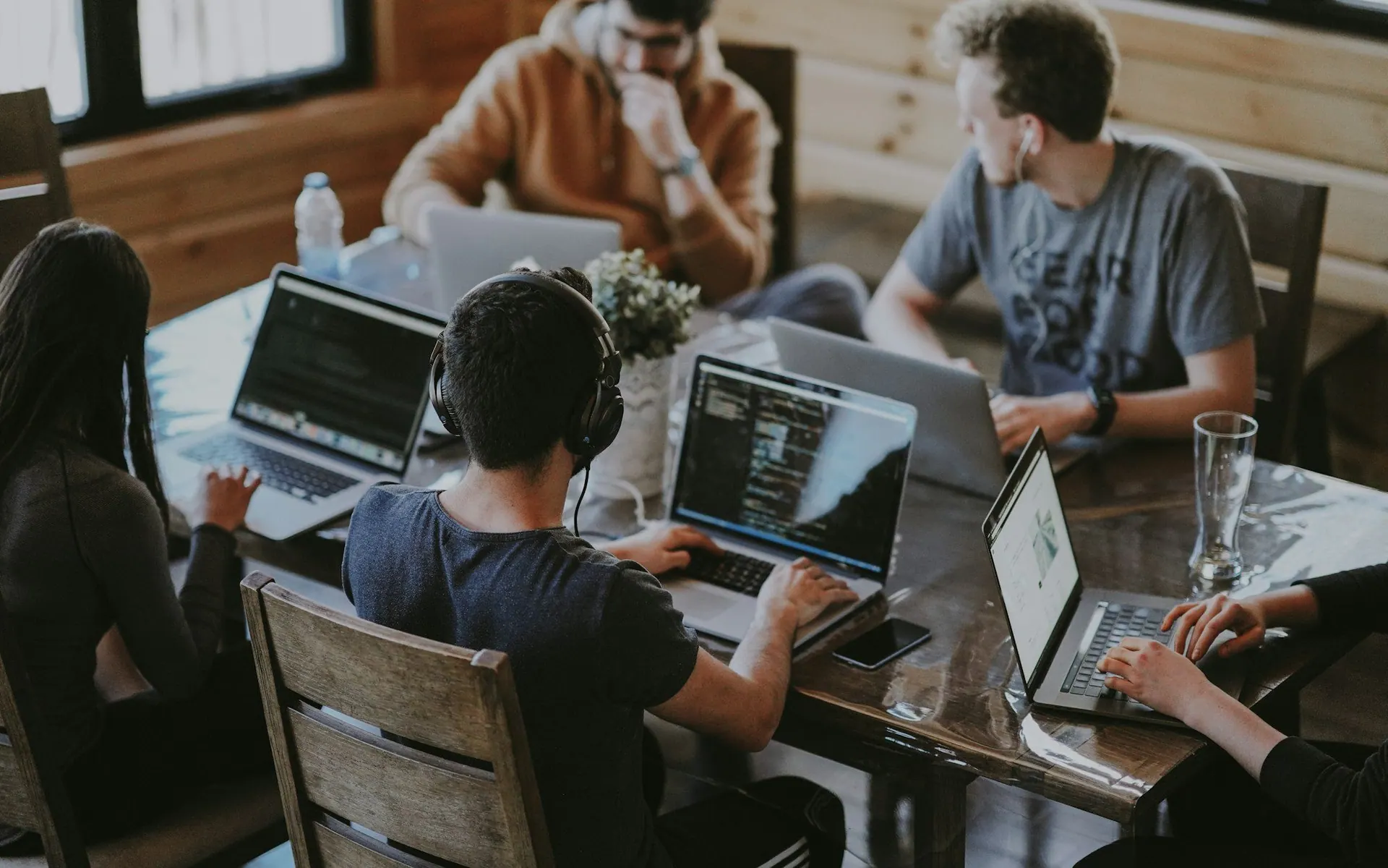 Small team working together around laptops