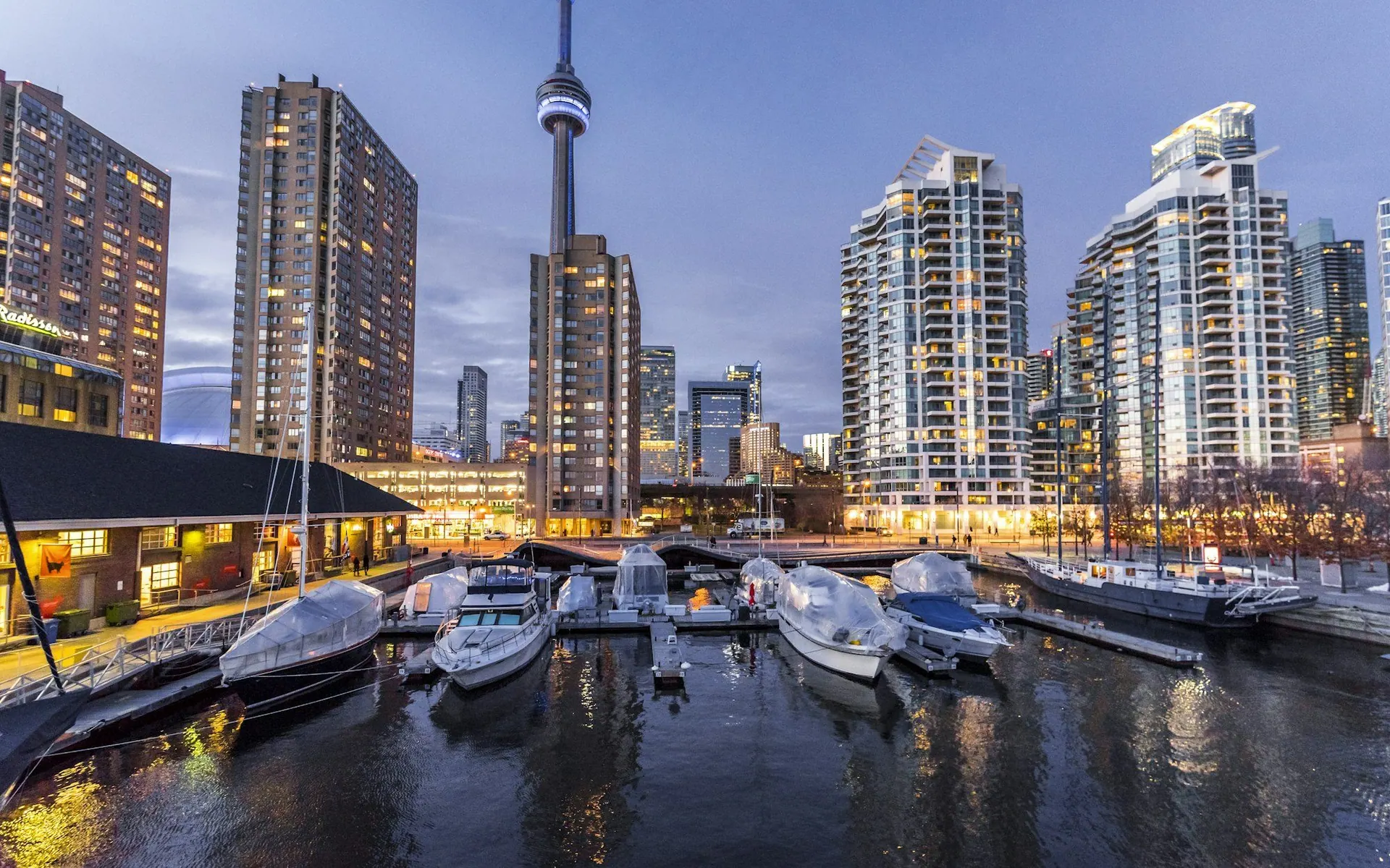 Toronto waterfront condominiums and the CN Tower at dusk