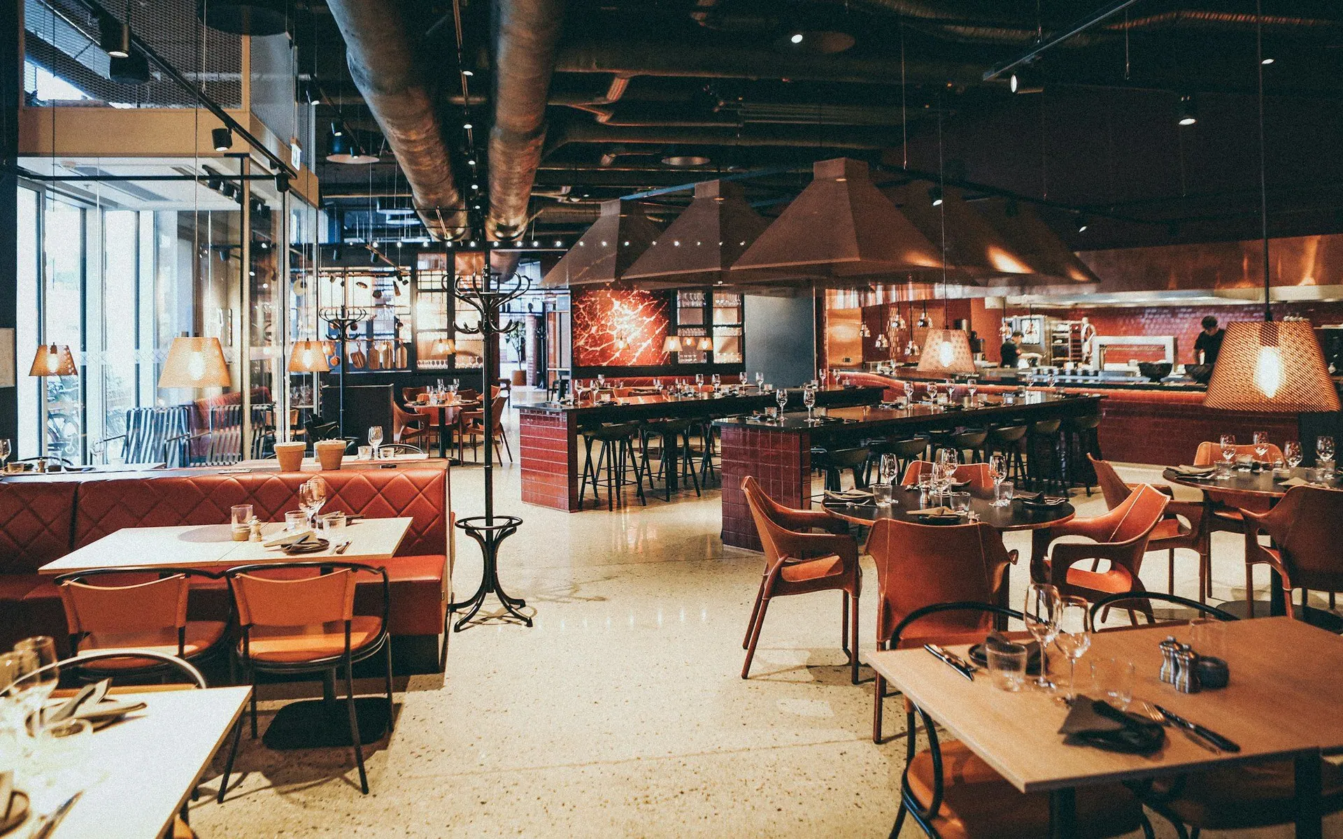 Warmly lit restaurant interior with booth seating